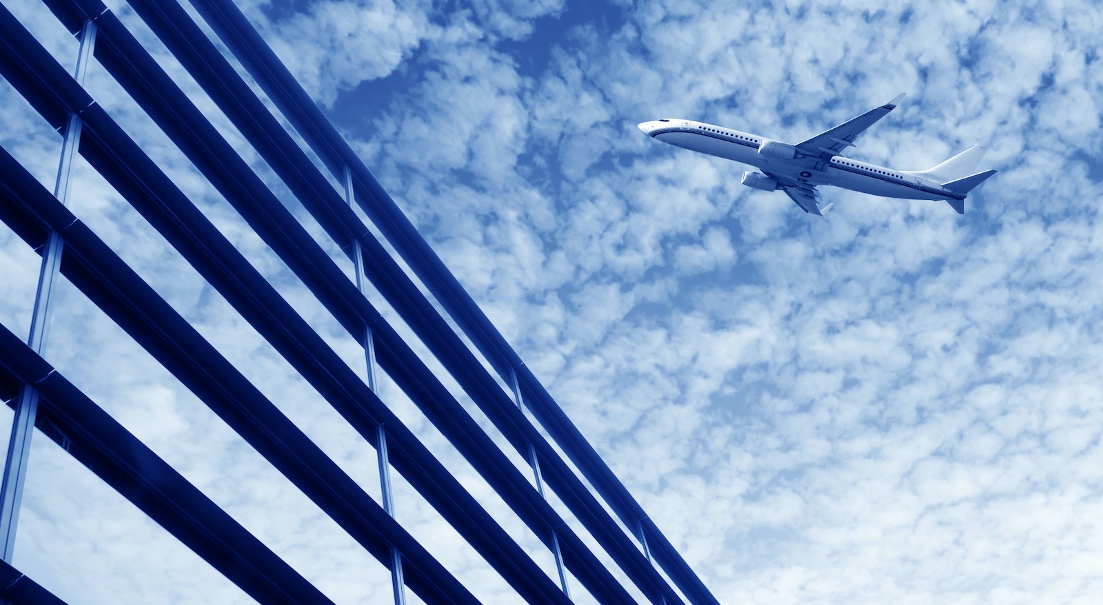 Future of aircraft safety - modern aircraft against a sky of clouds.